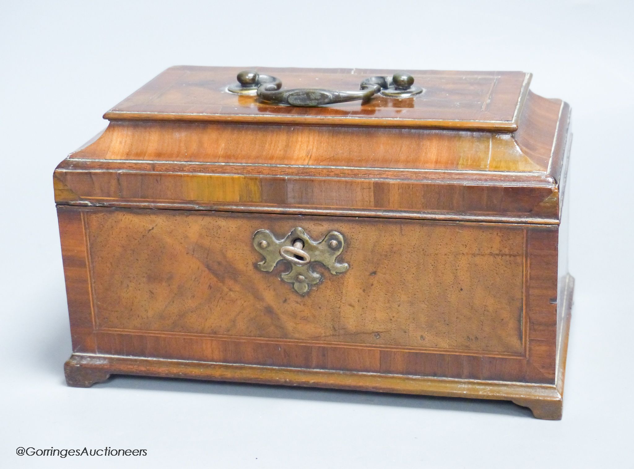 A late George II walnut line inlaid and cross banded tea caddy
